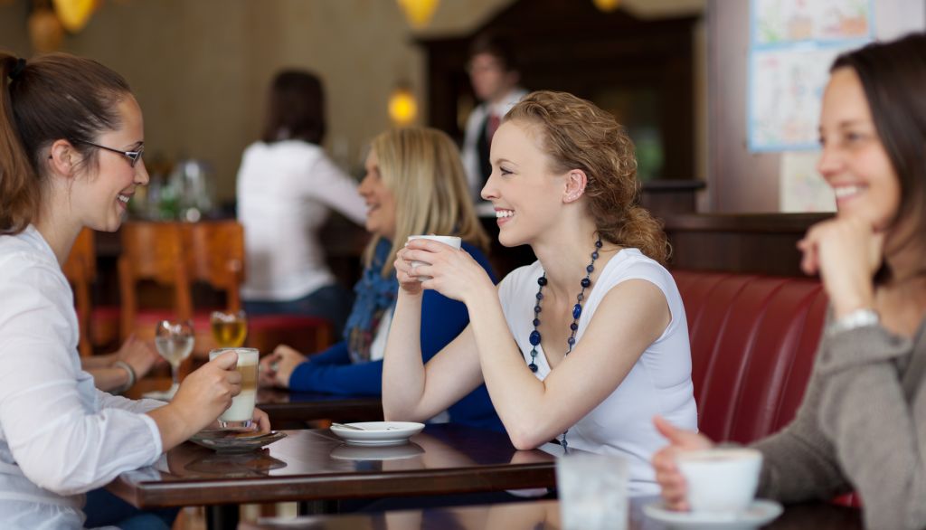 guests-enjoying-coffee-restaurant-focus-450w-150111695