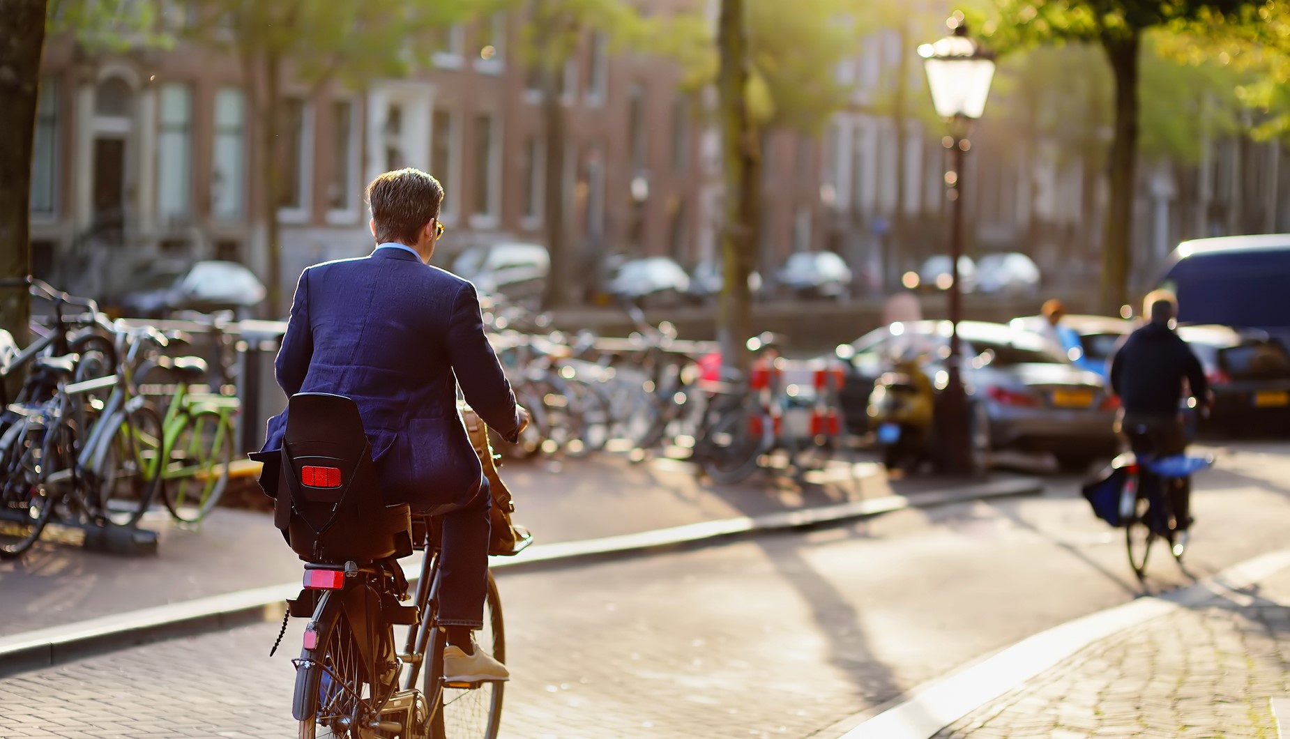 1850×1060-man-rides-bicycle